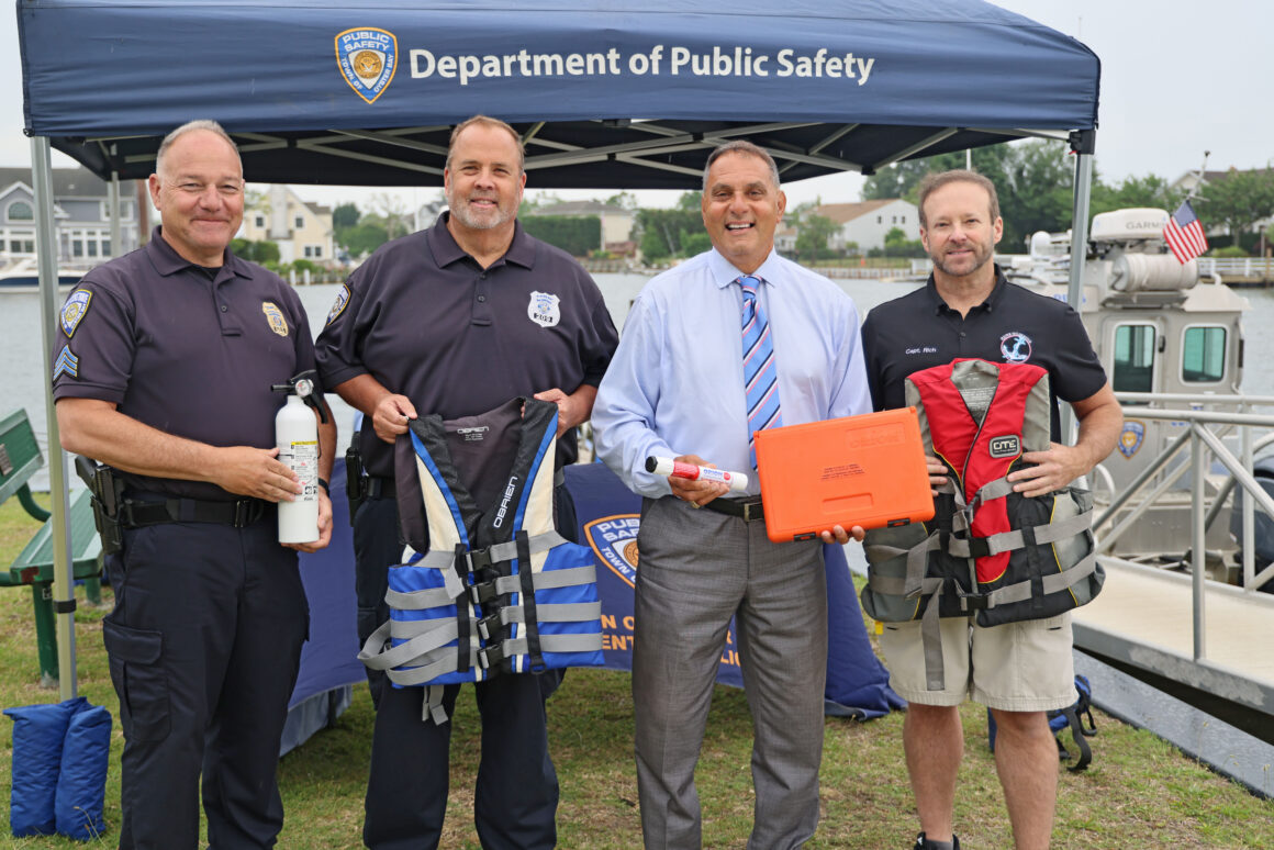 Town and marine law enforcement officials demonstrate boating safety equipment